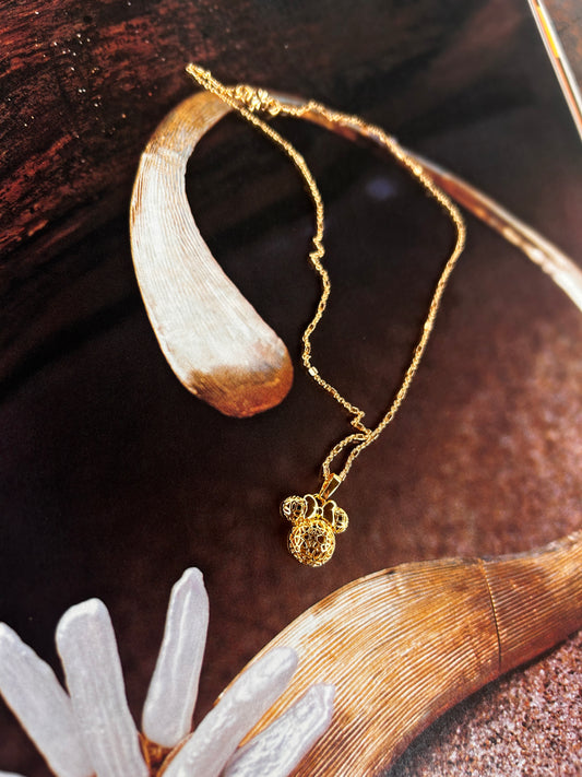 The Mickey Mouse in golden necklace