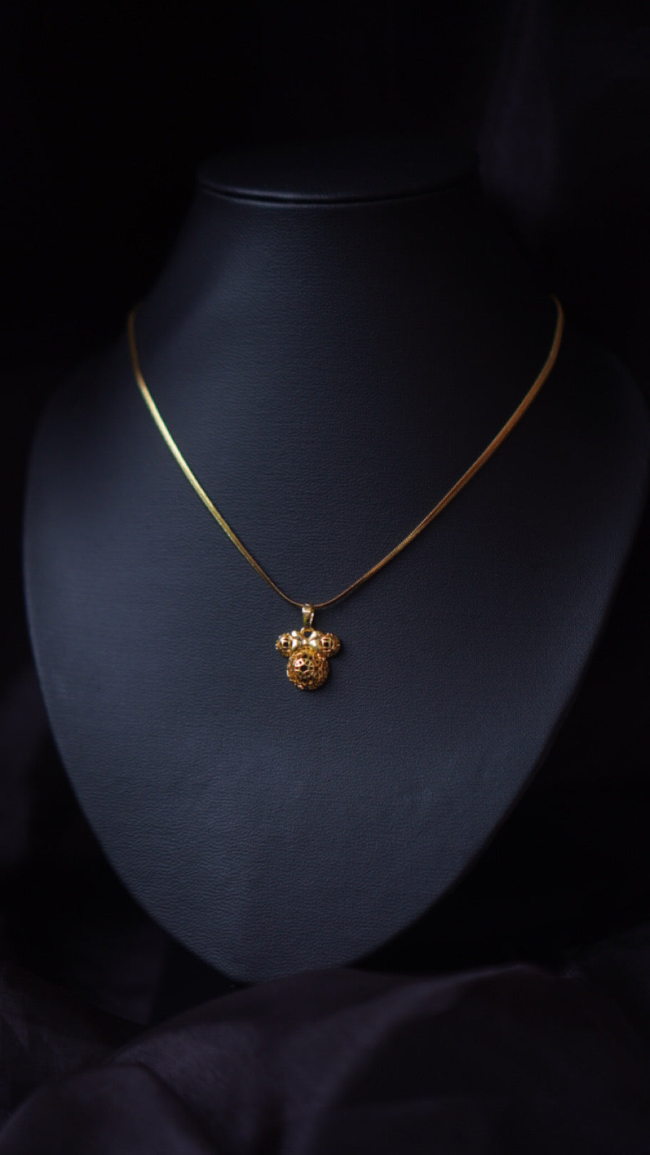 The Mickey Mouse in golden necklace